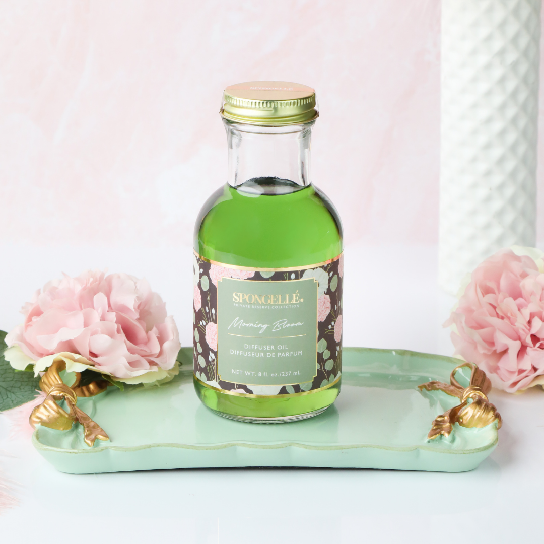 Spongellé Morning Bloom diffuser oil for home fragrance, featuring a sleek bottle with floral scent notes from the Private Reserve Collection.