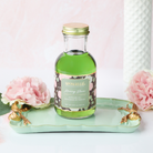 Spongellé Morning Bloom diffuser oil for home fragrance, featuring a sleek bottle with floral scent notes from the Private Reserve Collection.