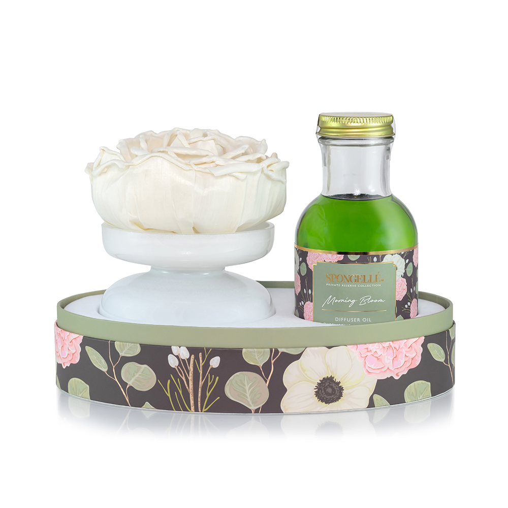 Spongellé Morning Bloom Private Reserve diffuser for home fragrance with elegant glass bottle and reed sticks.