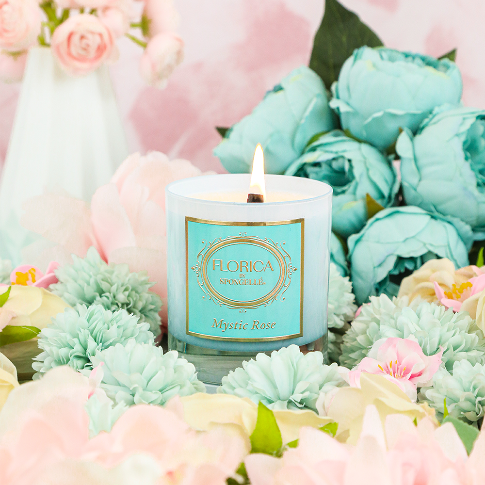 Mystic Rose Candle by Florica in a glass jar, showcasing a fragrant floral home fragrance from Spongellé.