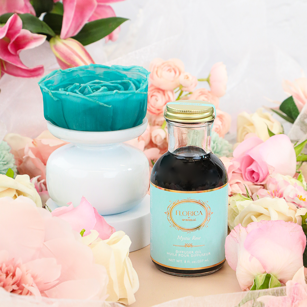 Mystic Rose Floret Diffuser by Florica, a home fragrance with a glass vessel and fresh rose floral arrangement.
