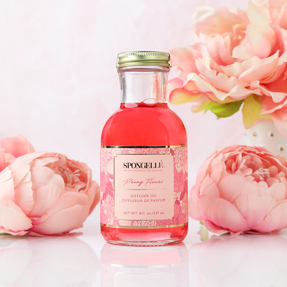 Spongellé Peony Flower Diffuser Oil from the Private Reserve Collection, a home fragrance with a floral peony scent in a glass bottle.