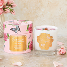 Spongellé Botanica Rose Candle, a home fragrance with a elegant glass holder and a blooming rose design.