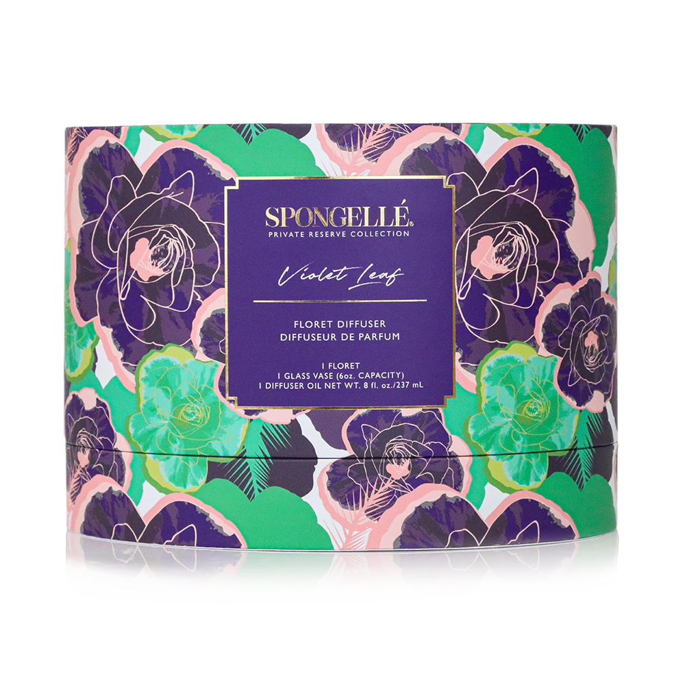 Violet Leaf Private Reserve diffuser by Spongellé, a home fragrance with a glass bottle and reed sticks for aromatic décor.