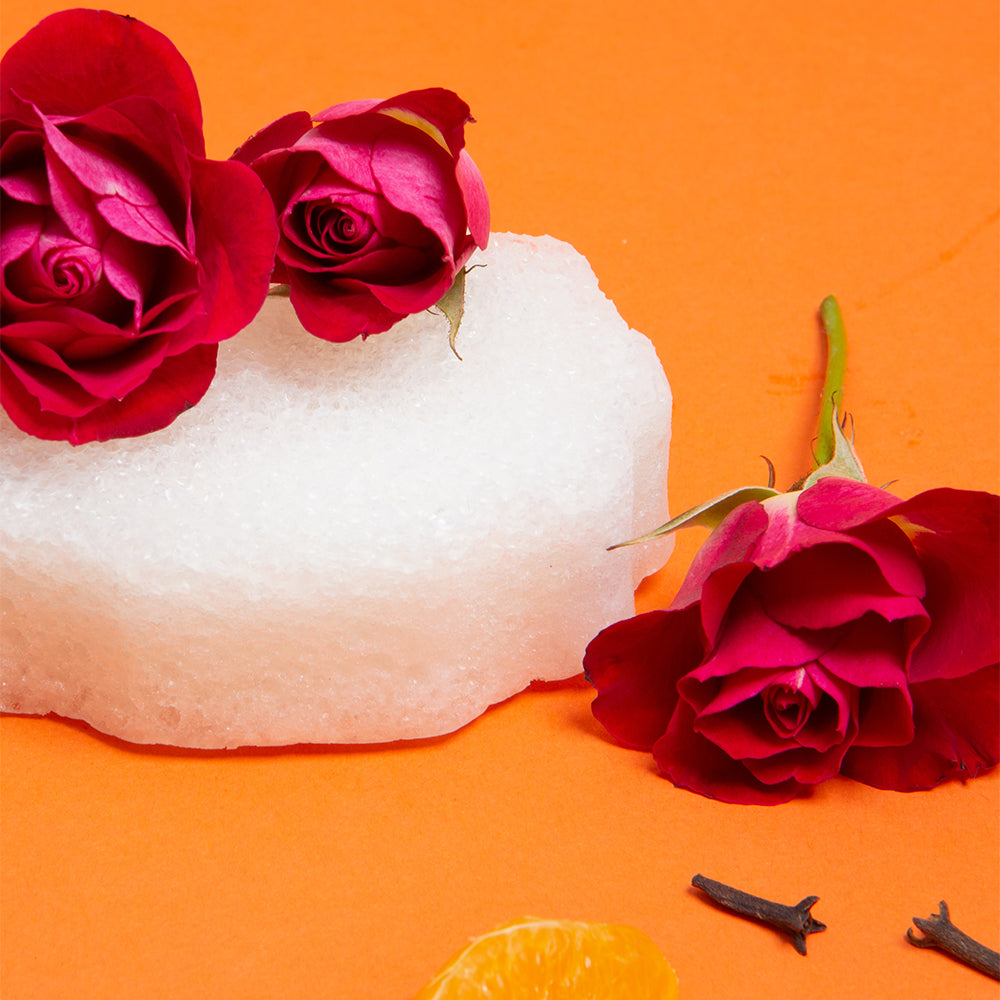 Spongellé Bulgarian Rose Pedi Buffer showing textured surface with rose scent branding for gentle foot exfoliation.