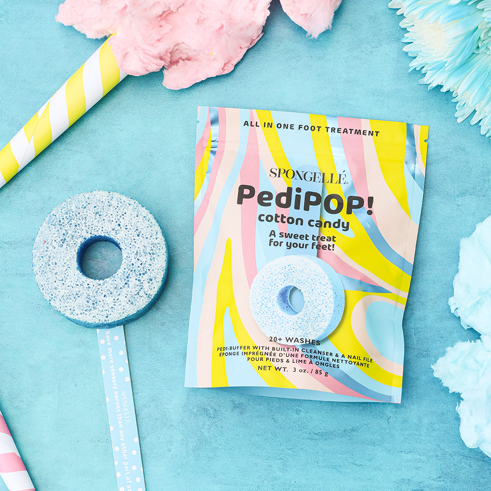 Spongellé PediPOP! Cotton Candy Pedi Buffer and Nail File for smooth, silky feet and nails in vibrant pink packaging.