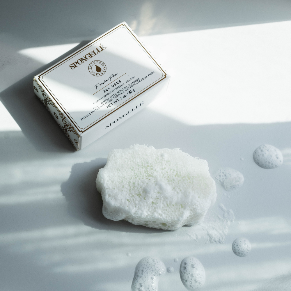 Spongellé Freesia Pear Pedi Buffer for gentle exfoliation and smooth skin in a compact, floral-scented design.