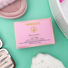 Spongellé French Lavender Pedi Buffer for smoothing and exfoliating feet with lavender-scented sponge in a close-up view.