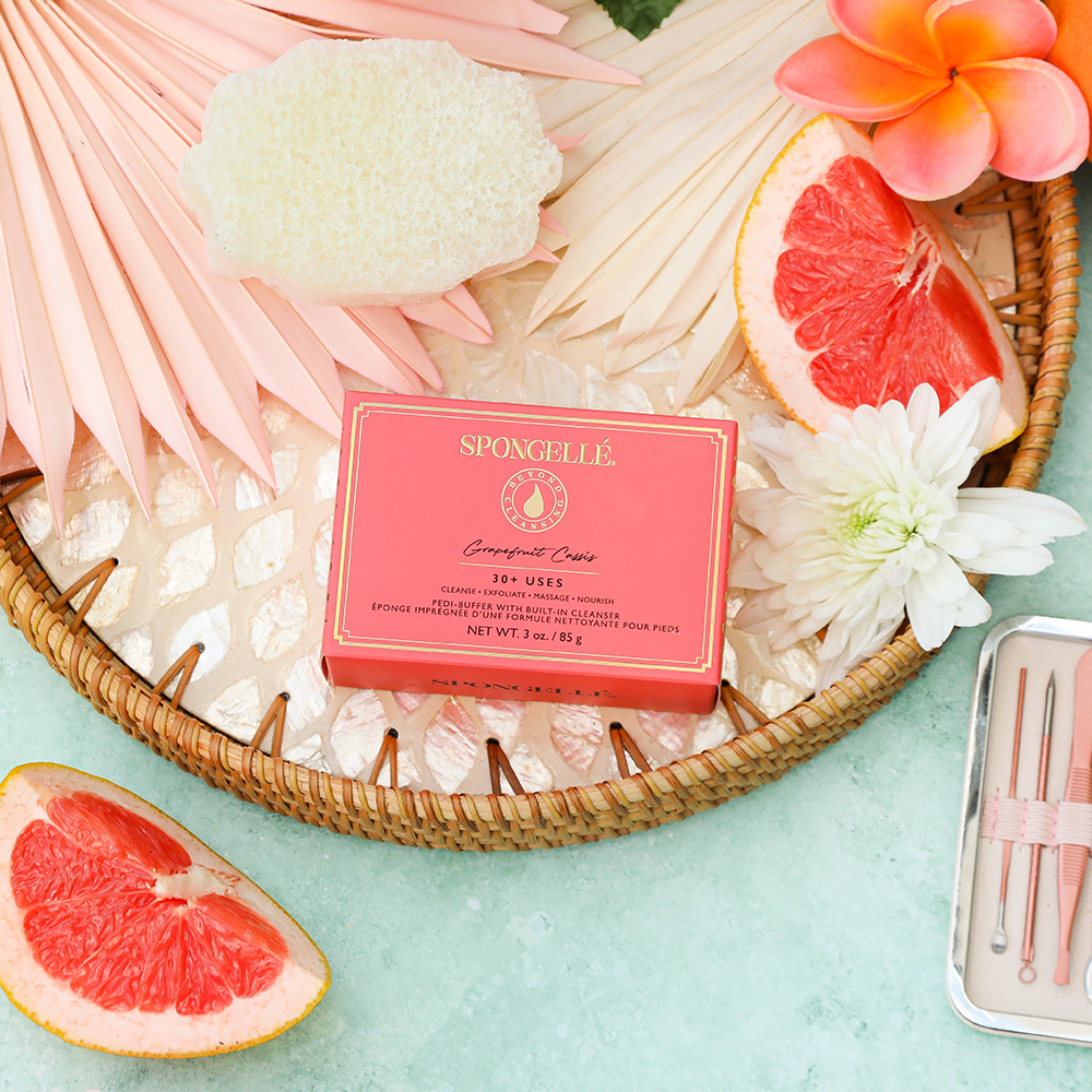 Spongellé Grapefruit Cassis Pedi Buffer with textured surface for exfoliating and smoothing feet.