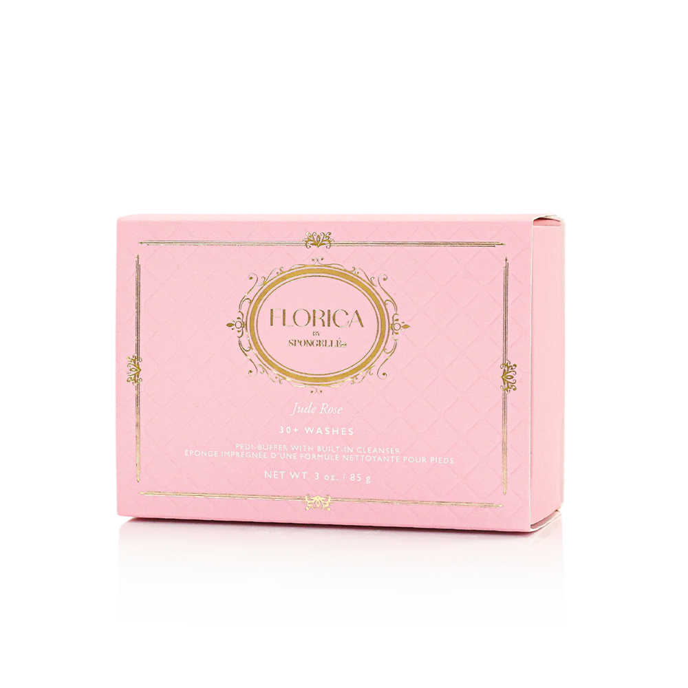 Spongellé Jude Rose Pedi Buffer showing pink and white textured surface for foot exfoliation and smoothing.