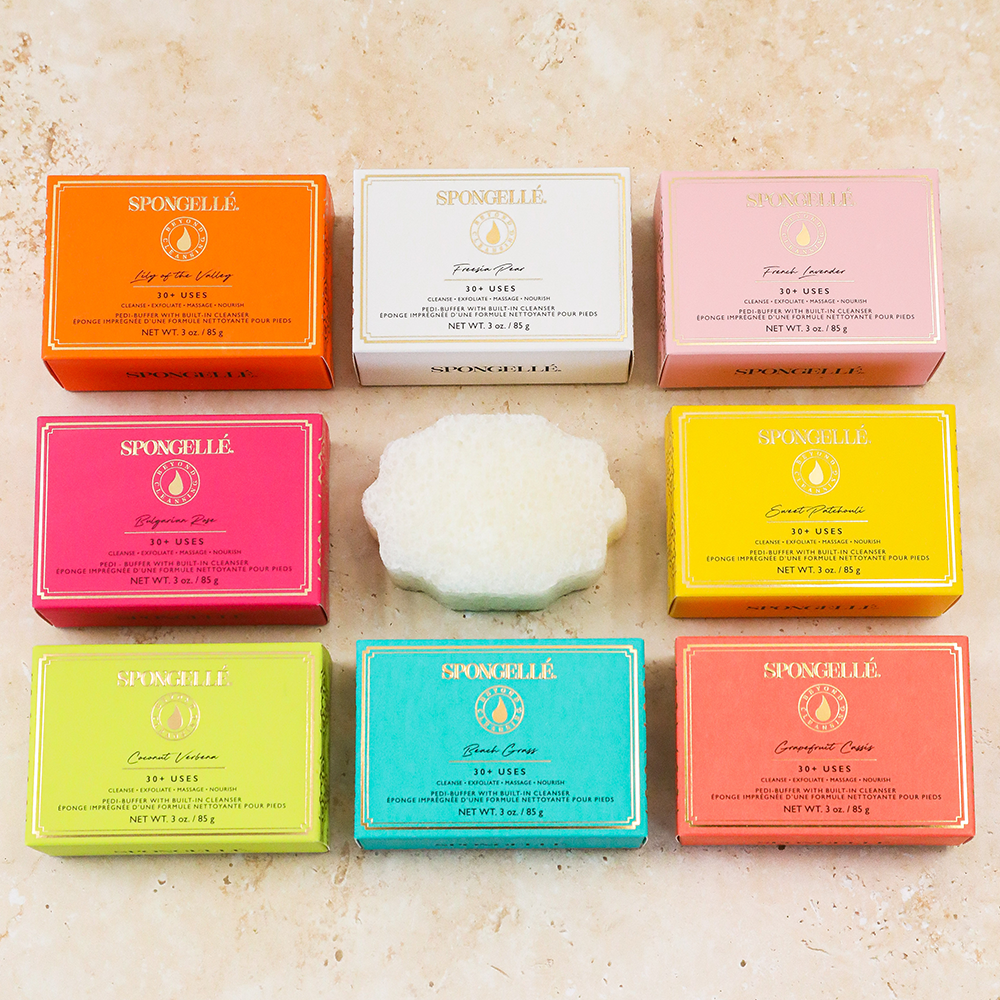 Assorted pack of Spongellé Pedi Buffer buffers for smoothing and exfoliating feet, shown in various colors and textures.