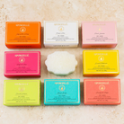 Assorted pack of Spongellé Pedi Buffer buffers for smoothing and exfoliating feet, shown in various colors and textures.