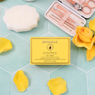 Spongellé Sweet Patchouli Pedi Buffer showing textured surface for exfoliating feet in a close-up image