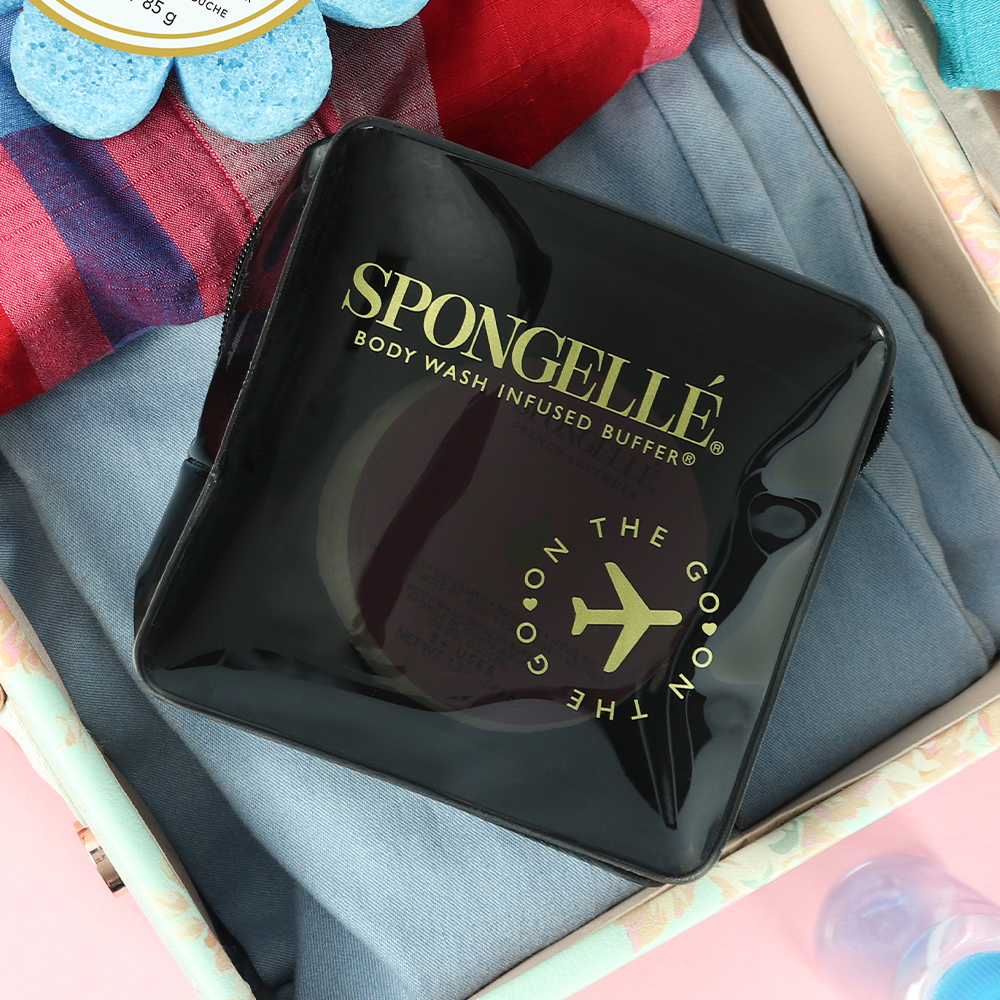 Black Spongellé travel case made of durable material, designed to securely hold toiletries for easy travel organization.