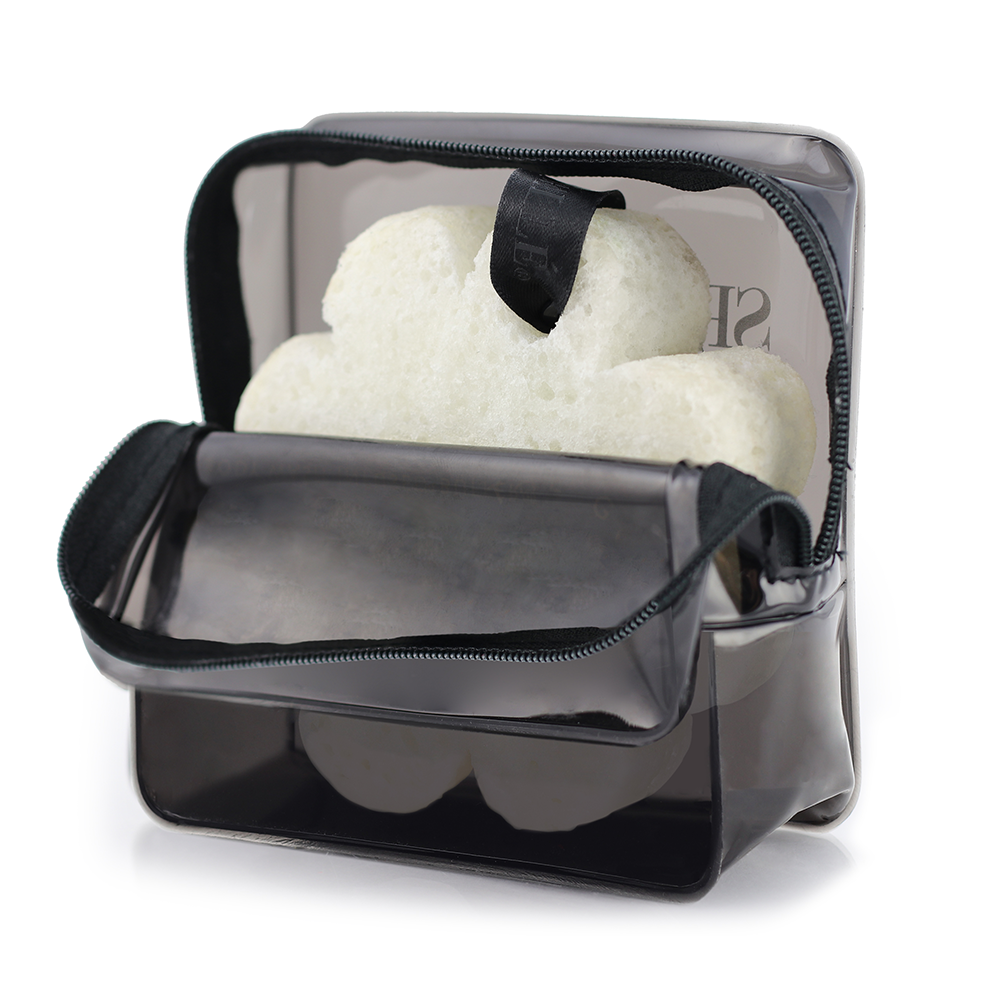 Black Spongellé travel case with zipper closure, compact and stylish for storing toiletries and travel essentials.