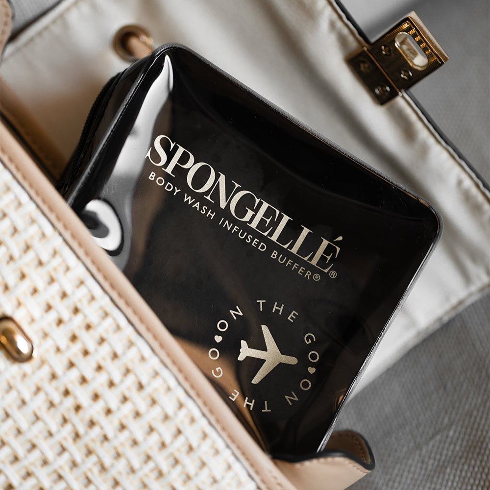 Black Spongellé travel case with zipper closure, compact design, ideal for storing toiletries and travel essentials.
