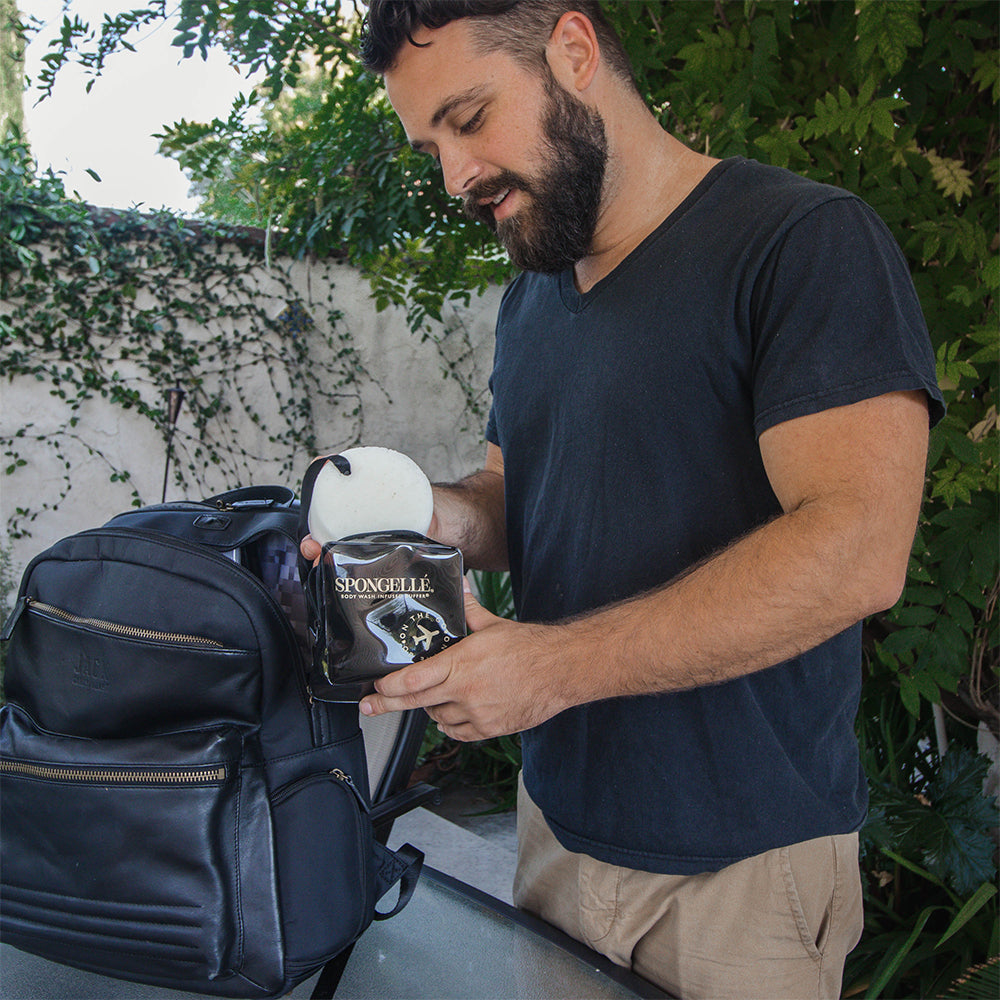 Black Spongellé travel case with zipper closure, compact and durable for organizing toiletries on the go.