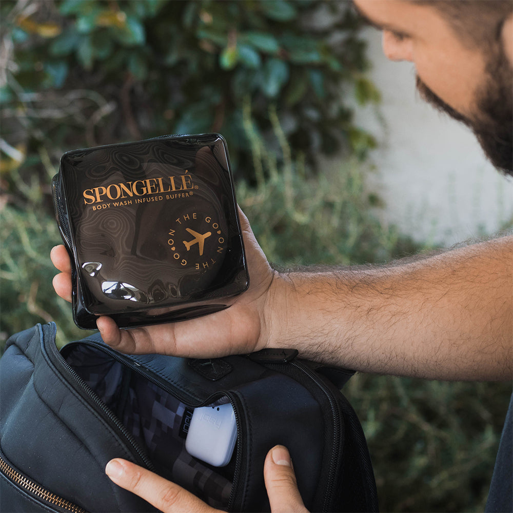 Black Spongellé travel case with zipper closure, compact and durable for organizing toiletries and accessories during travel.