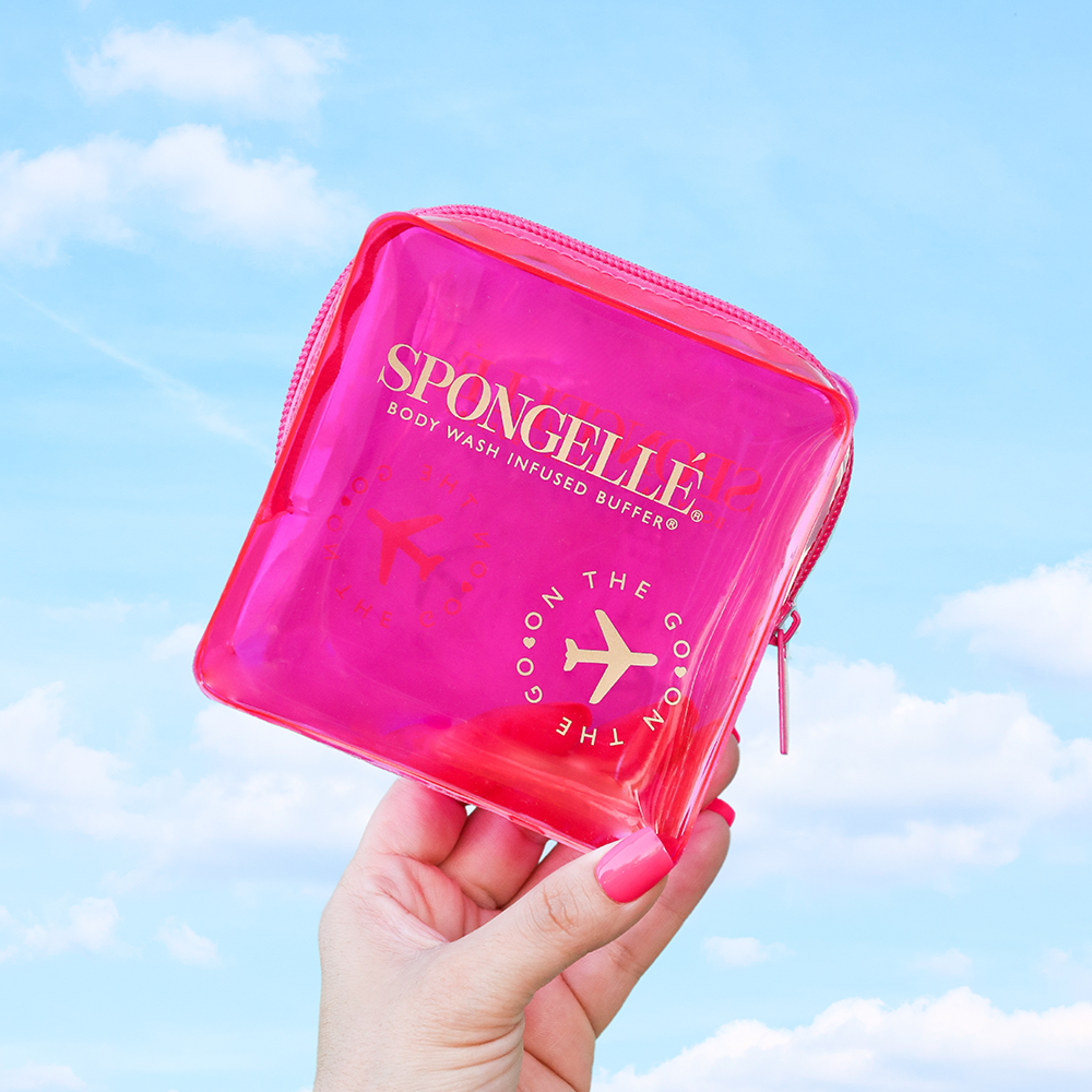 Pink Spongellé travel case with a compact, protective design for storing toiletries and travel essentials.