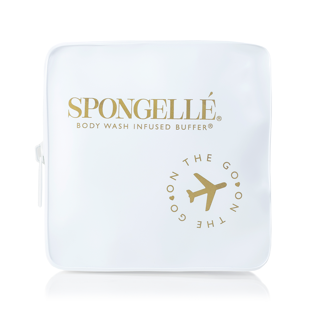 White Spongellé travel case with zipper closure, compact and durable for organizing toiletries on the go.