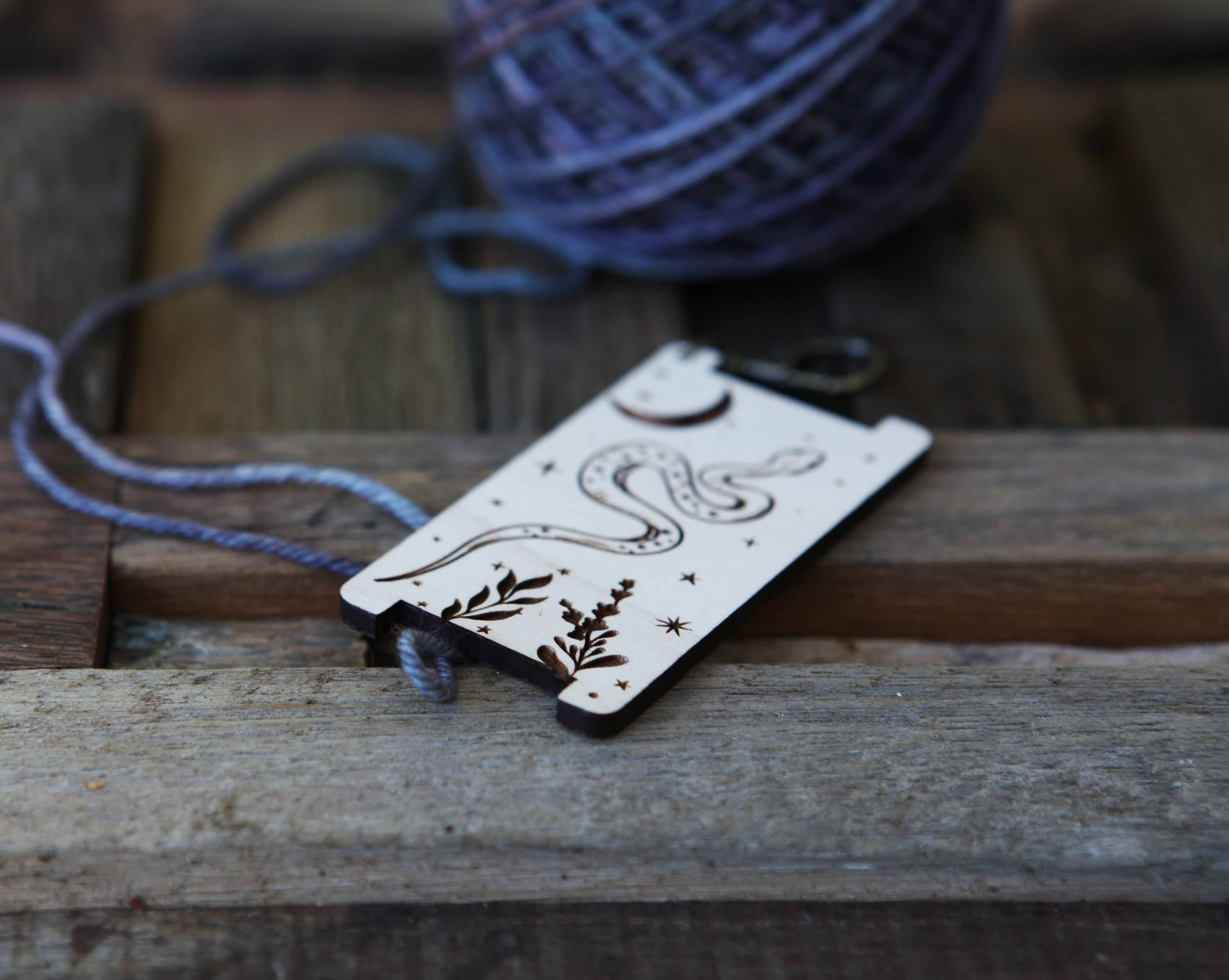 Mountaintop Yarn Crescent Moon & Stars Snake WPI Ruler with forest plant design, ideal for measuring gauge for yarn and fabric projects.