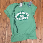 Sunshine and Whiskey Shamrock unisex graphic t-shirt by The Graphic Tee, featuring a vibrant shamrock and sunshine design.