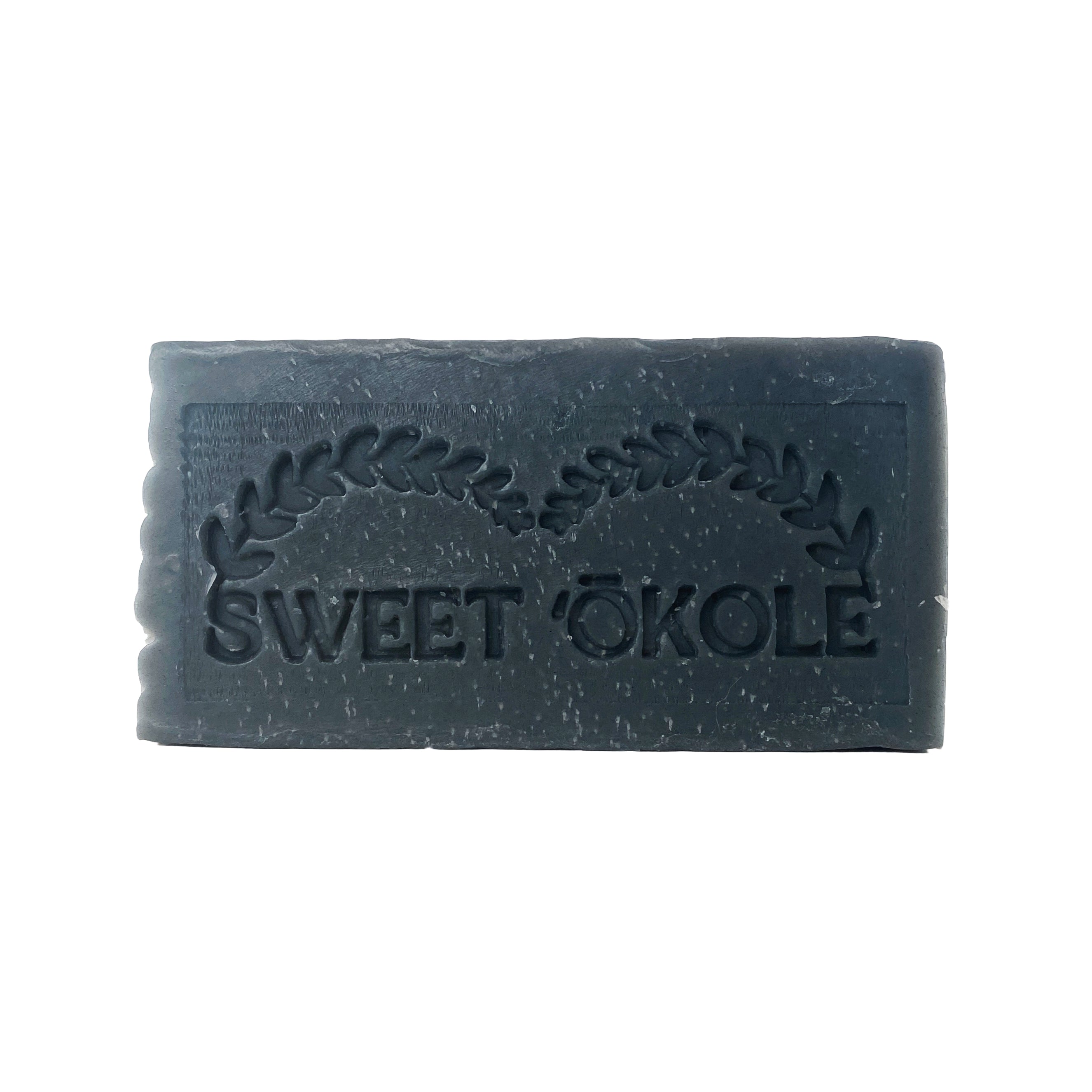 Charcoal and tea tree soap bar by Sweet ʻŌkole Soap, microbiome-friendly cleanser with natural ingredients, suitable for clear skin.