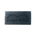 Charcoal and tea tree soap bar by Sweet ʻŌkole Soap, microbiome-friendly cleanser with natural ingredients, suitable for clear skin.