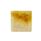 Essential oil conditioner bar with citrus and patchouli scent featuring turmeric and Olena from Sweet ʻŌkole Soap.