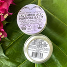 Lavender balm by Sweet ʻŌkole Soap, calming essential oil salve in a small jar with lavender flowers and herbal ingredients.
