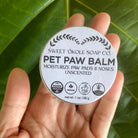 Natural Pet Paw Balm by Sweet ʻŌkole Soap, moisturizing paw salve for dogs and cats, showing the balm jar with paw print label.