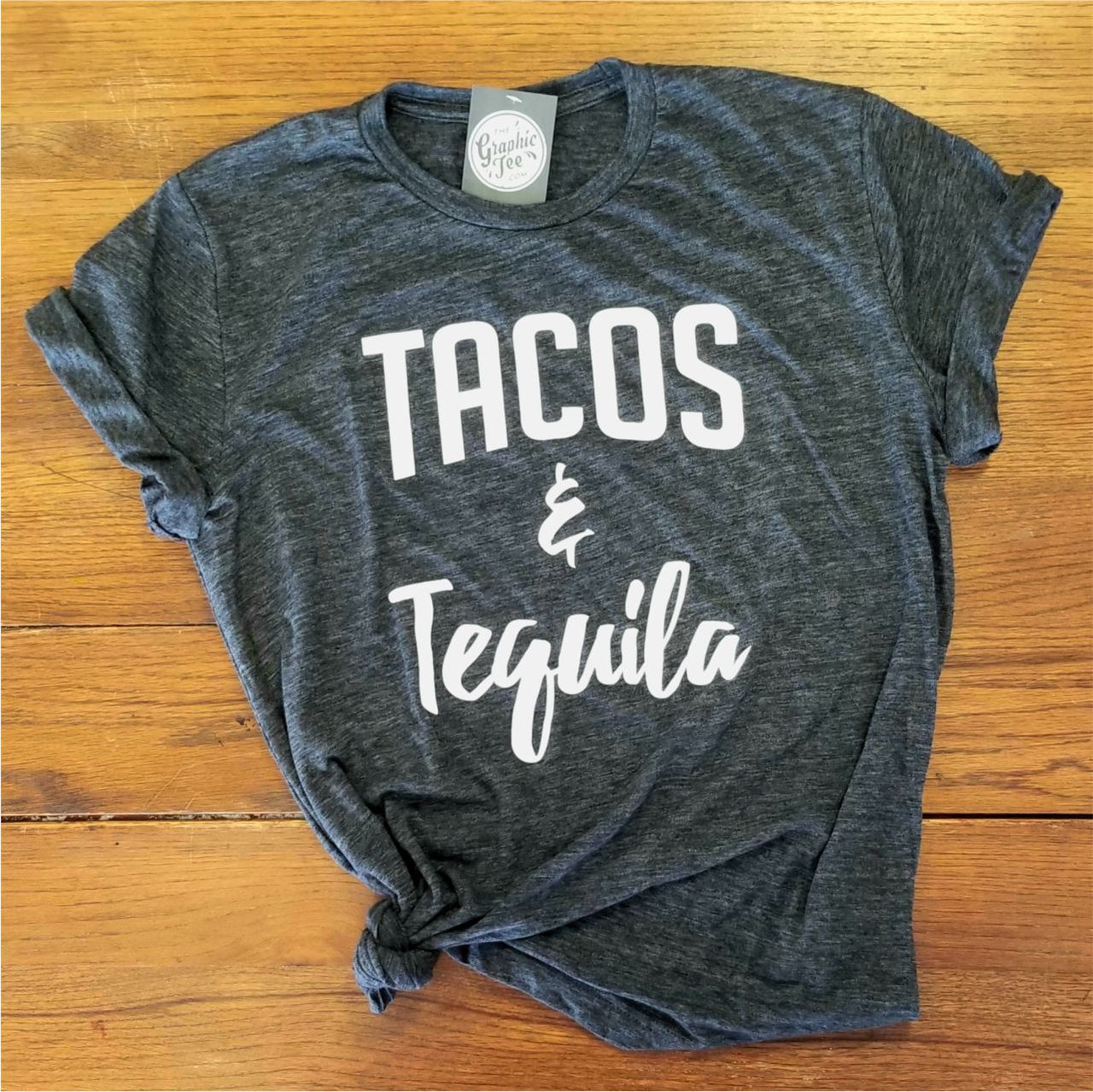 Unisex graphic T-shirt featuring tacos and tequila design, casual SS crew neck by The Graphic Tee, stylish and fun for everyday wear.