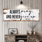 Canvas wall sign with inspirational message "Always Pray And Never Give Up" featuring Luke 18:1, by Tailored Canvases.