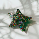 Velvet Claws Glitter Star Hair Claw accessory with star-shaped design and sparkly finish, perfect for stylish hair styling.