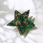 Velvet claw hair clip with glittery star design, stylish accessories from The Bullish Store, perfect for securing hair.