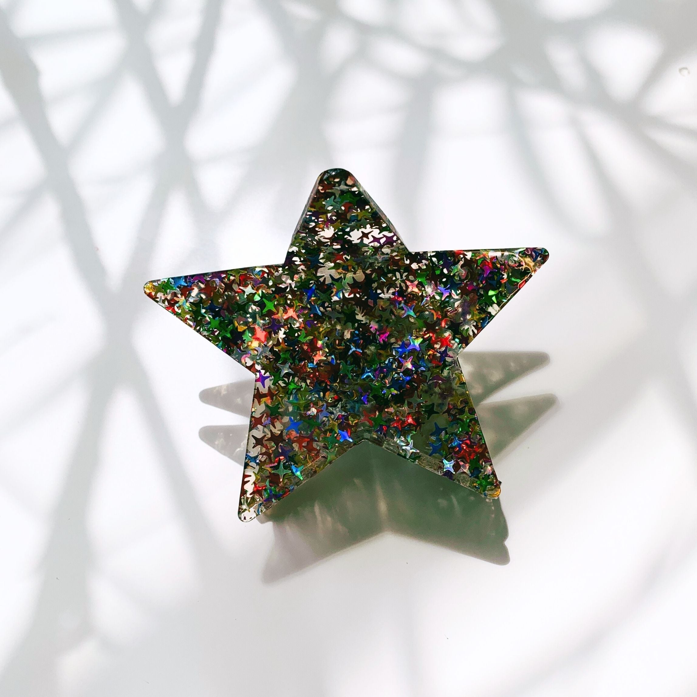 Velvet Claws glitter star hair claw accessory with a shiny star design, perfect for stylish hair styling.