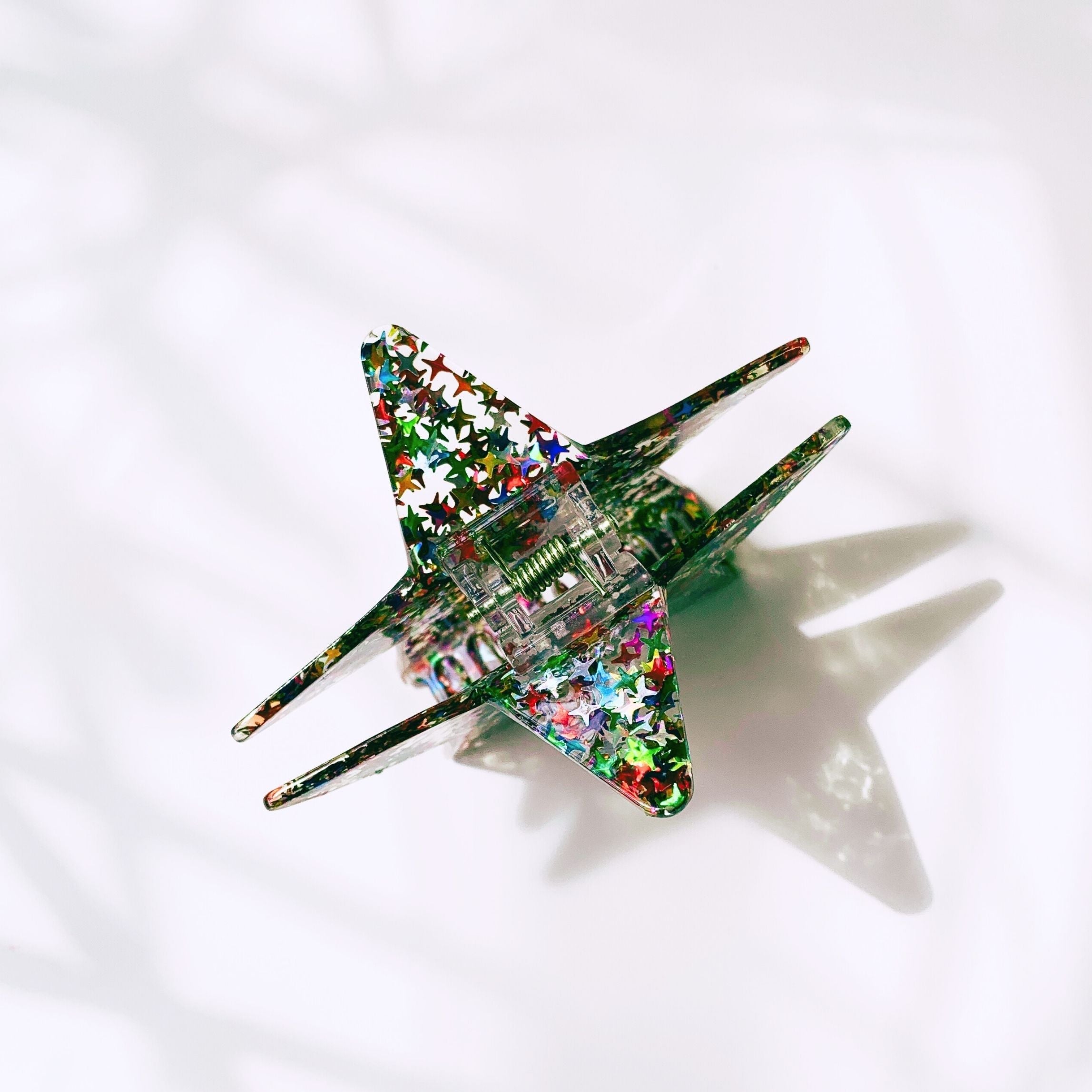 Velvet Claws glitter star hair claw from The Bullish Store, featuring a shiny star design and velvet finish for stylish hair accessories.