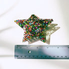 Velvet Claws Glitter Star Hair Claw accessory with sparkly star design, suitable for securing hair in a stylish, decorative way.