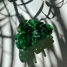Velvet Claws Monstera leaf hair claw accessory with green leaf design, crafted by The Bullish Store, perfect for hair styling.