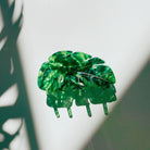 Velvet Claws Monstera leaf hair claw accessory with green velvet leaf design, perfect for stylish hair styling.