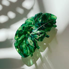 Velvet Claws Monstera leaf hair claw accessory in green with velvet texture, designed for stylish hair styling.