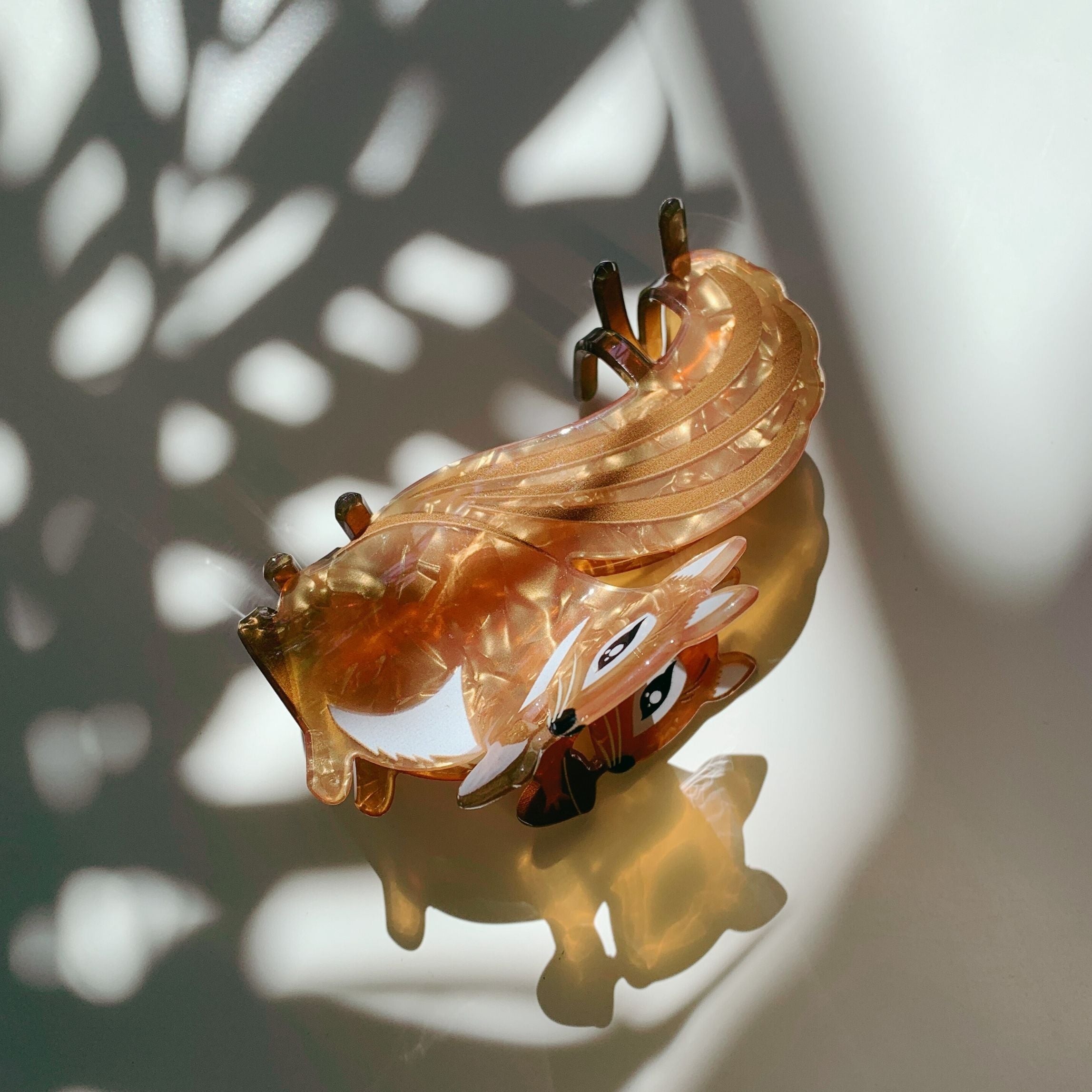 Velvet Claws squirrel holding acorn hair claw clip from The Bullish Store, featuring a soft velvet texture and playful design.