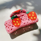 Velvet Claws strawberry granny square hair claw accessory by The Bullish Store, featuring a colorful woven design for hair styling.