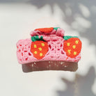 Velvet Claws Strawberry Granny Square Hair Claw from The Bullish Store, featuring a colorful crochet pattern accessory for hair.