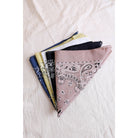Dusty rose muted color boho hair scarf headband, made of fabric, styled as a versatile bandana or head tie.