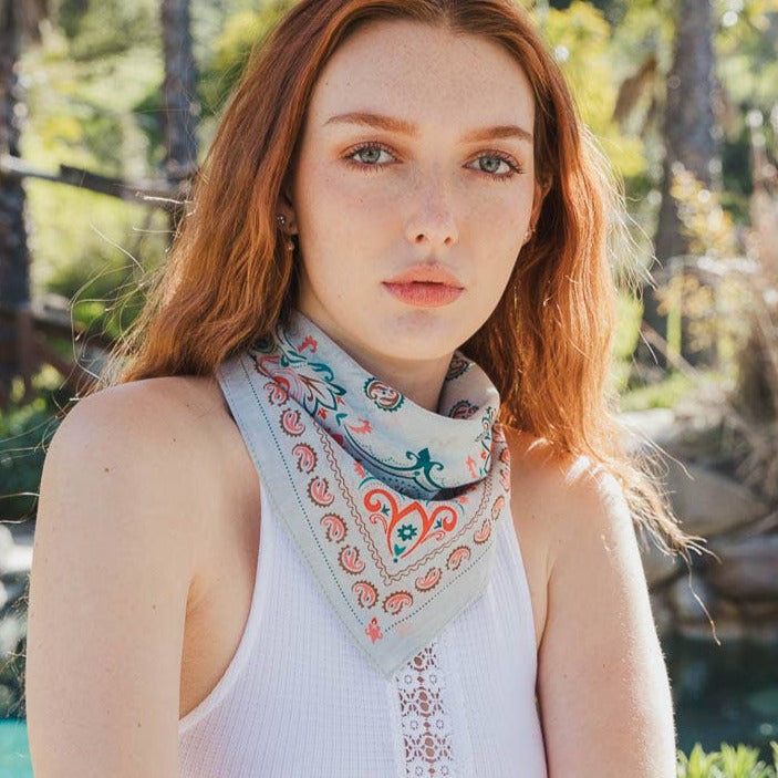 Teal vintage paisley bandana by The Bullish Store, featuring colorful patterns perfect for headwear, necktie, or accessory.