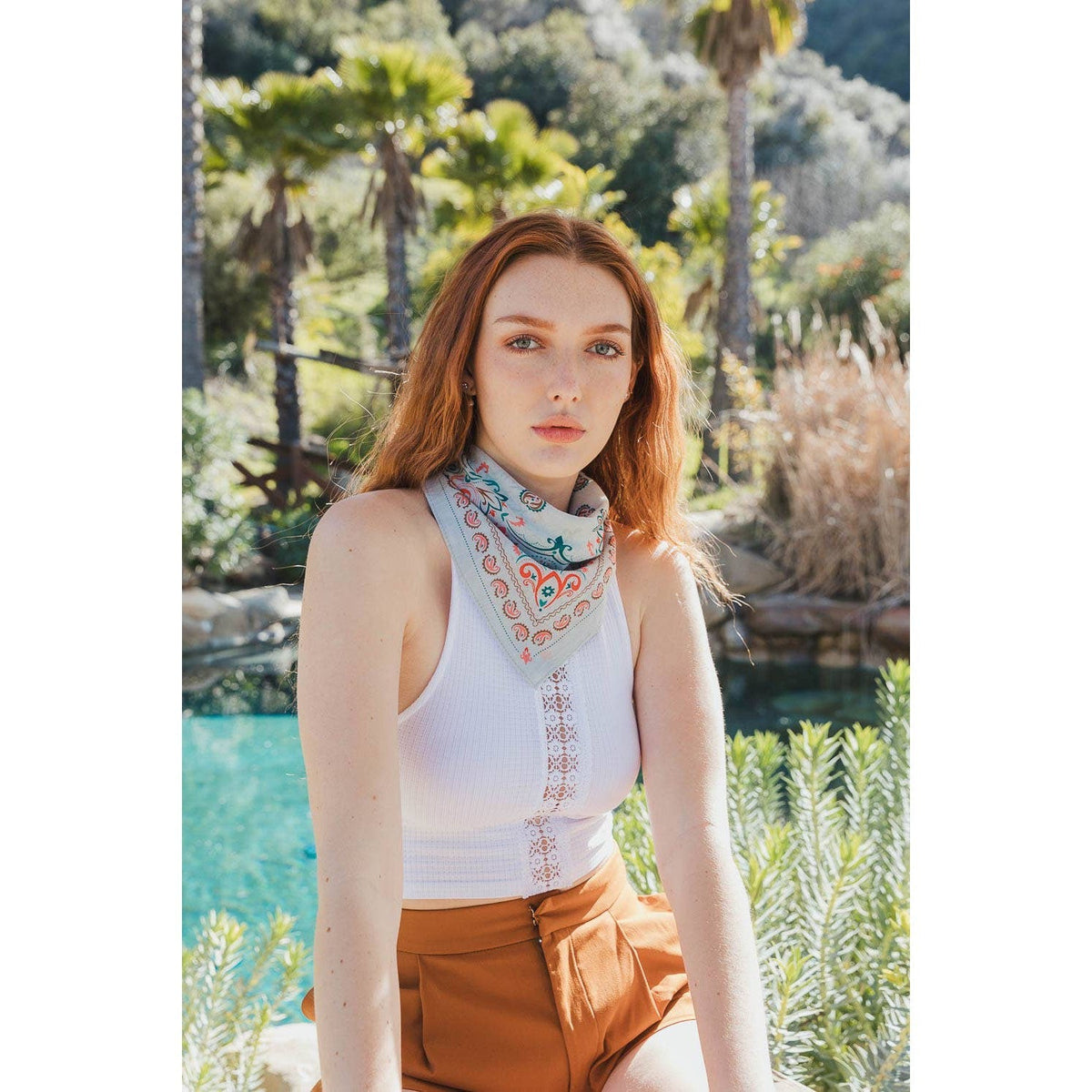 Teal vintage paisley bandana from The Bullish Store, featuring colorful patterns, suitable as a scarf, handkerchief, or necktie.