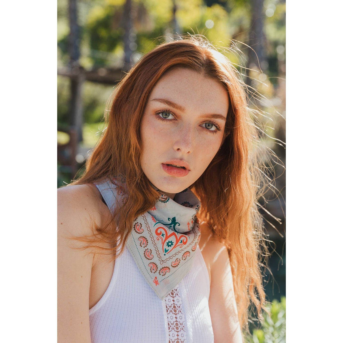 Teal vintage colorful paisley bandana from The Bullish Store, featuring intricate paisley patterns, versatile scarf or headtie accessory.