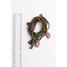 Stack of 10 boho stone and bead stretch bracelets from The Bullish Store, featuring colorful and textured jewelry accessories.