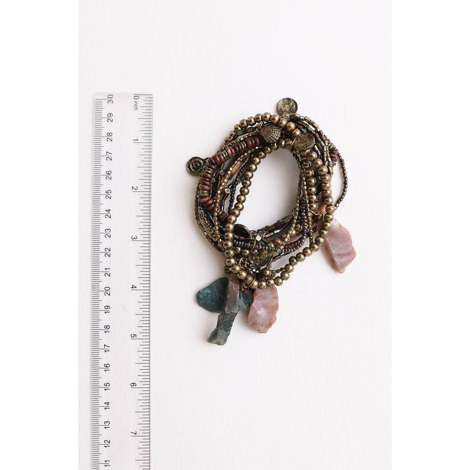 Stack of 10 boho stone and bead stretch bracelets from The Bullish Store, featuring colorful and textured jewelry accessories.